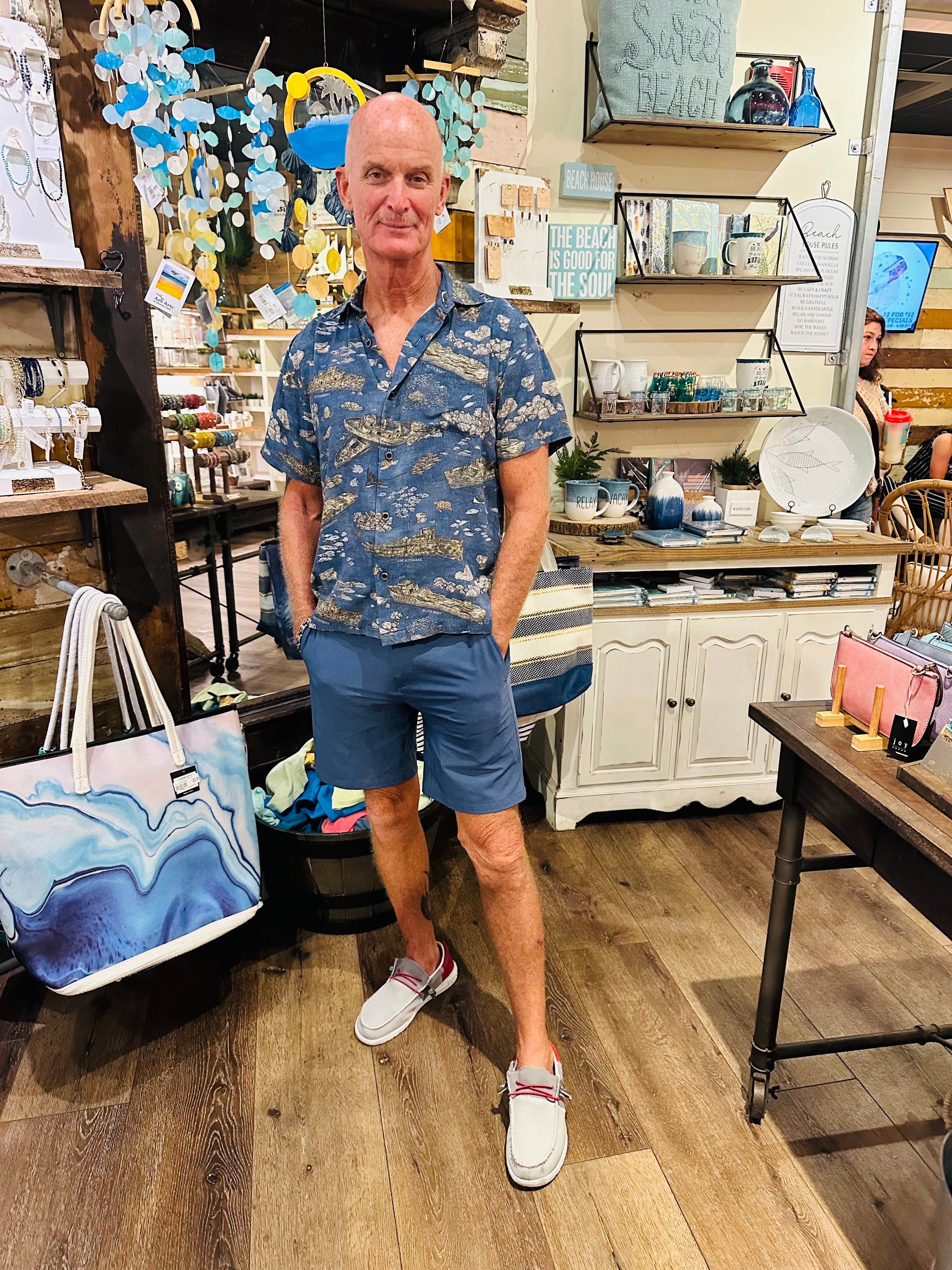 A man wearing the Dive PCB Floridian Shirt by Okihasi.