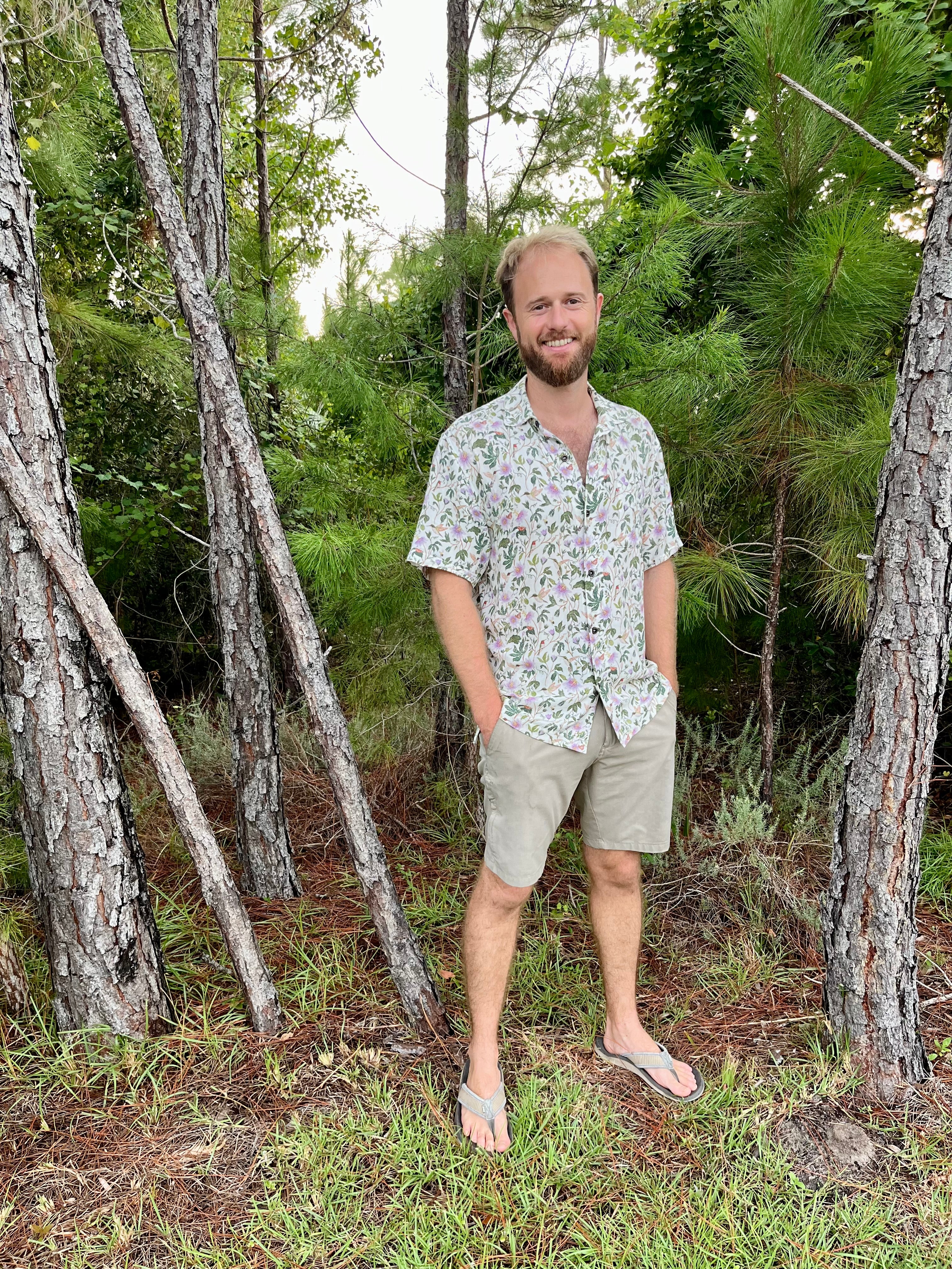 A man wearing the Passionflower Floridian Shirt by Okihasi.