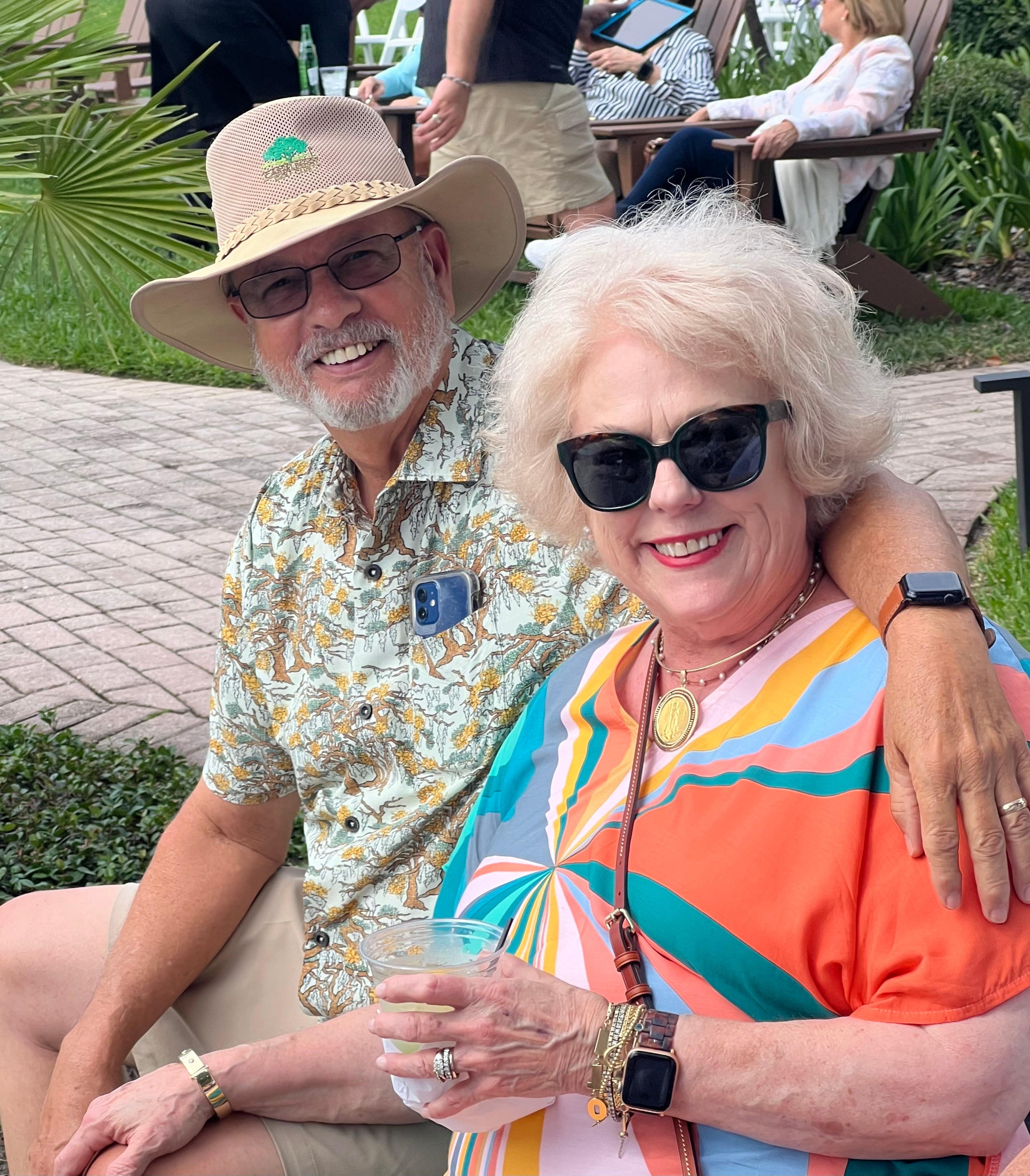 A man wearing the Southern Live Oak Floridian Shirt by Okihasi (left side) with his wife on the right.