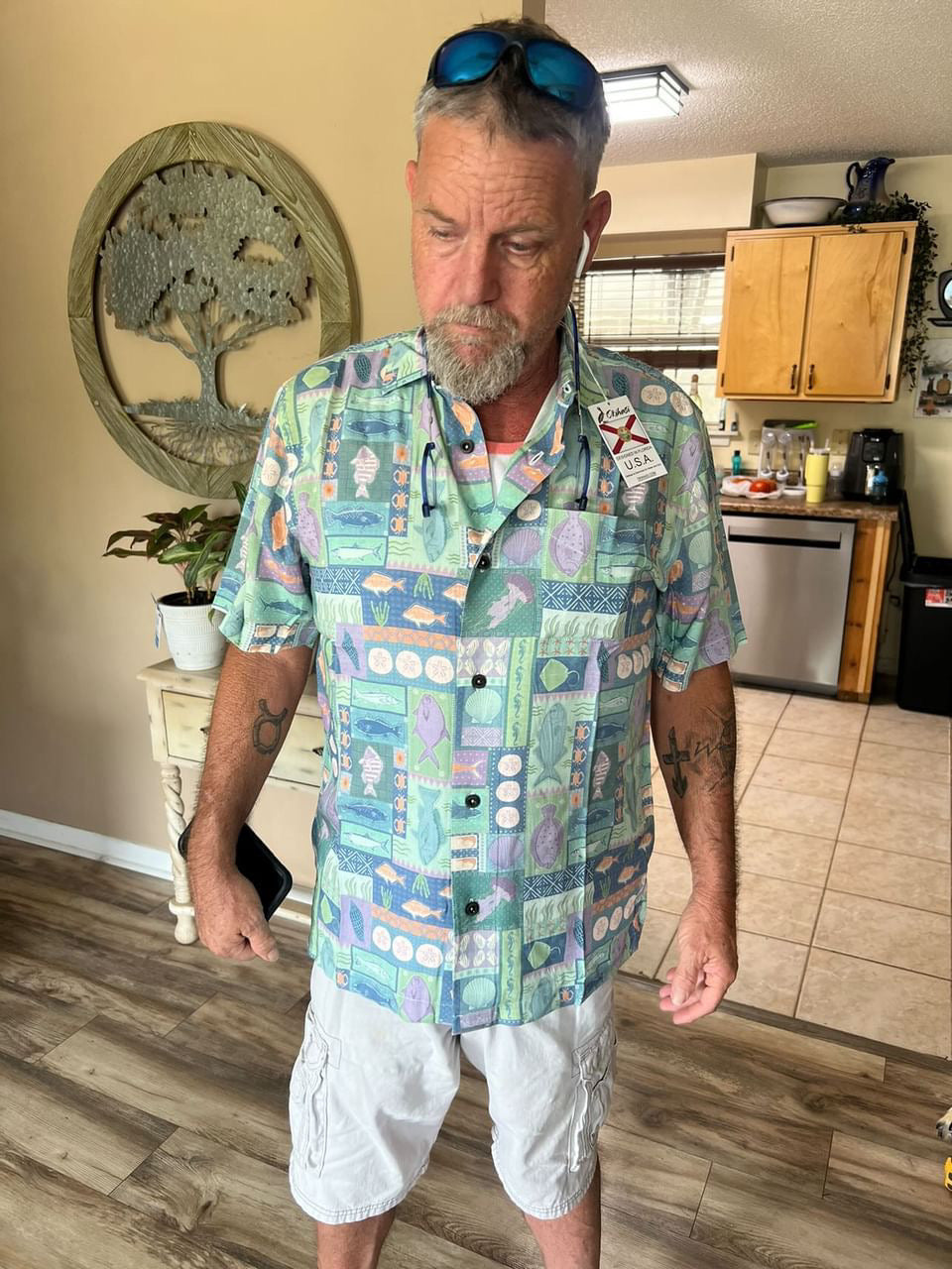 A man wearing the Inland Fish Floridian Shirt by Okihasi.