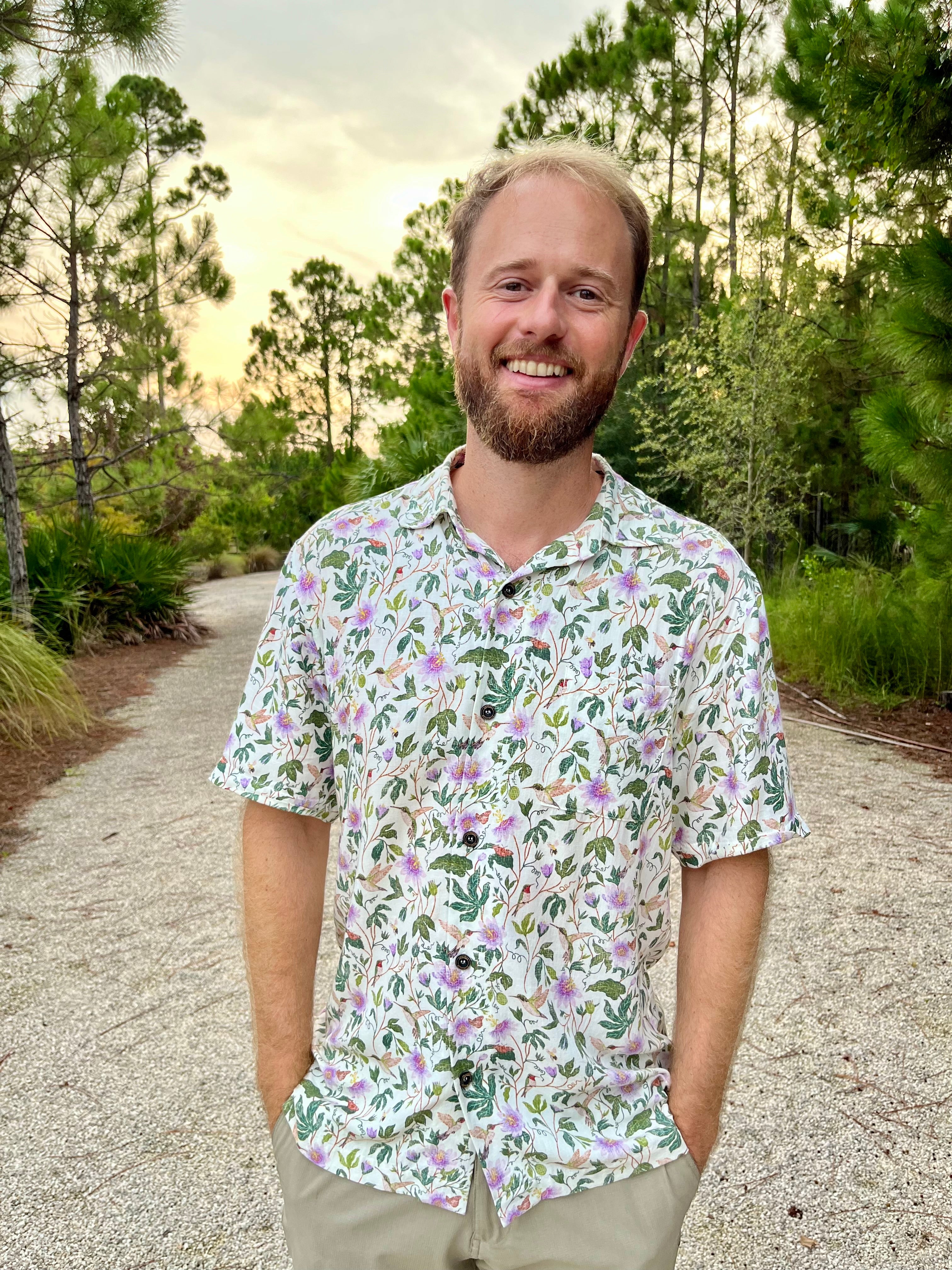 A man wearing the Passionflower Floridian Shirt by Okihasi.