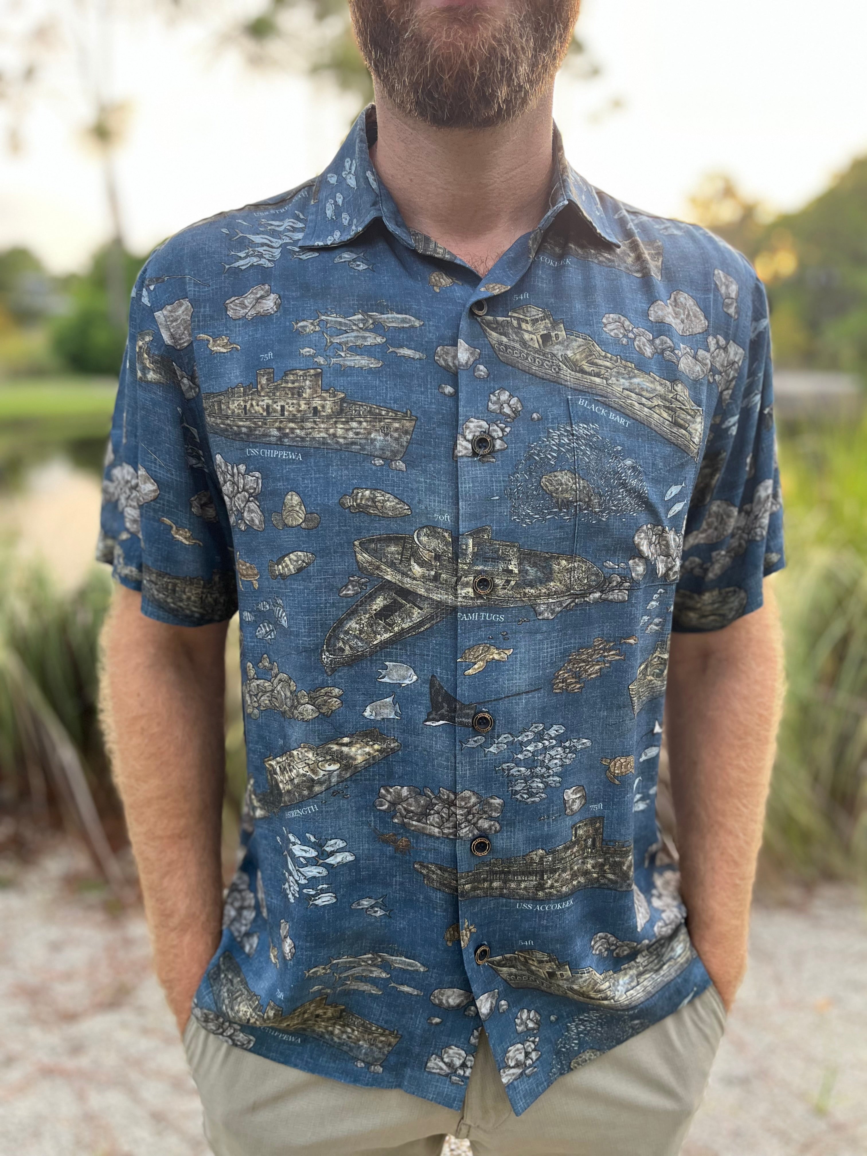 A man wearing the Dive PCB Floridian Shirt by Okihasi.