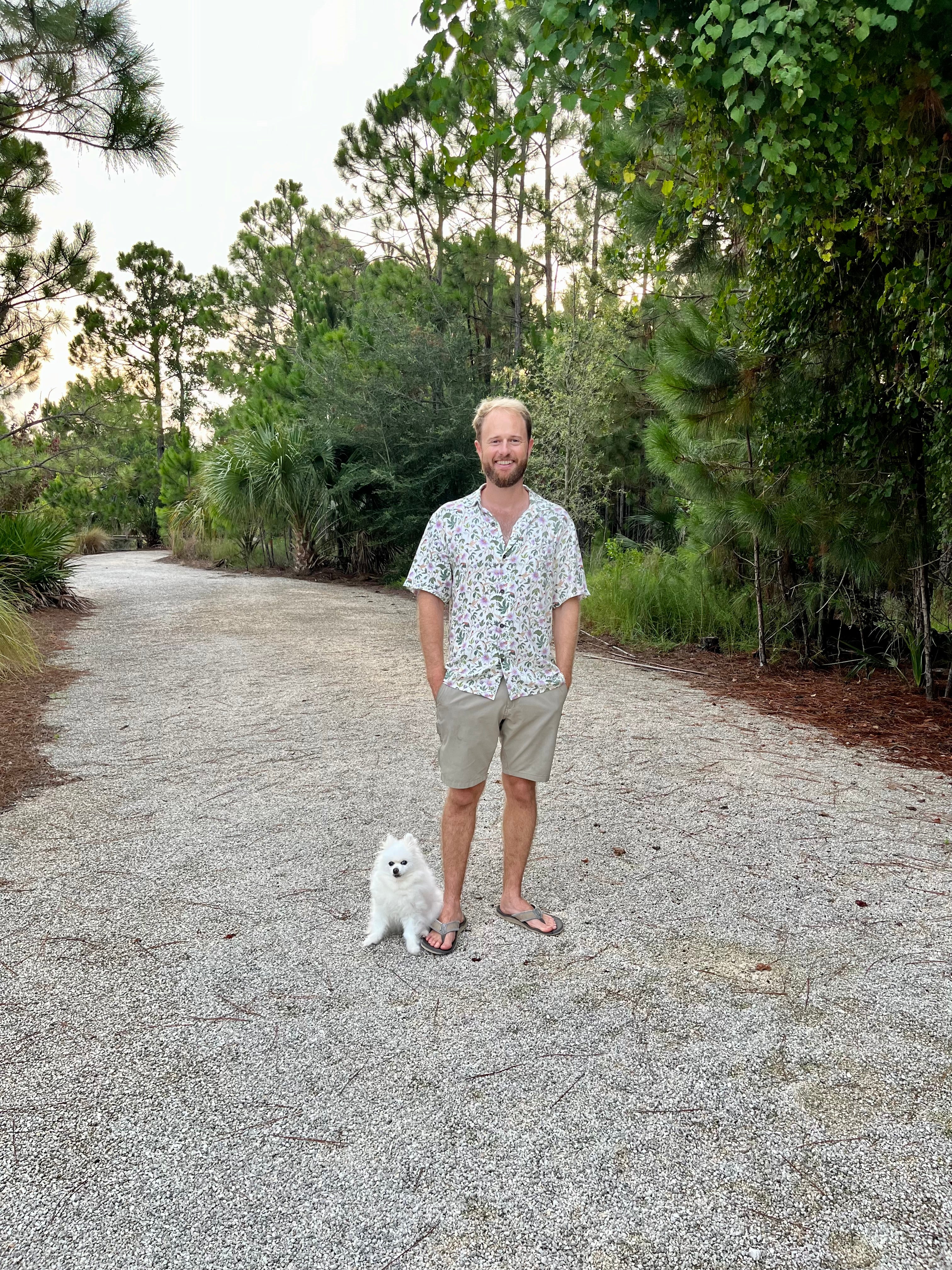 A man wearing the Passionflower Floridian Shirt by Okihasi.