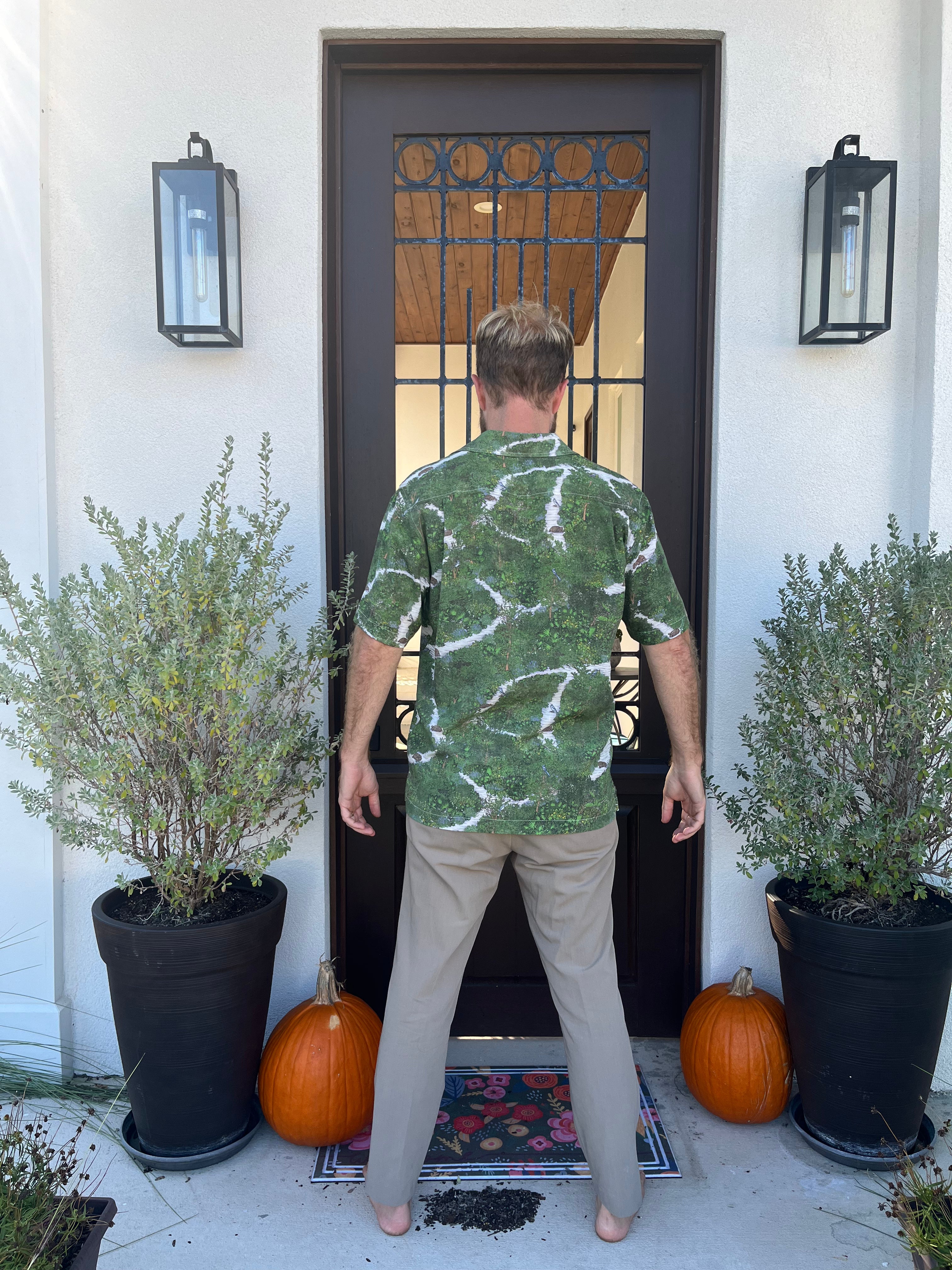 A man wearing the Florida Scrub Floridian Shirt by Okihasi.
