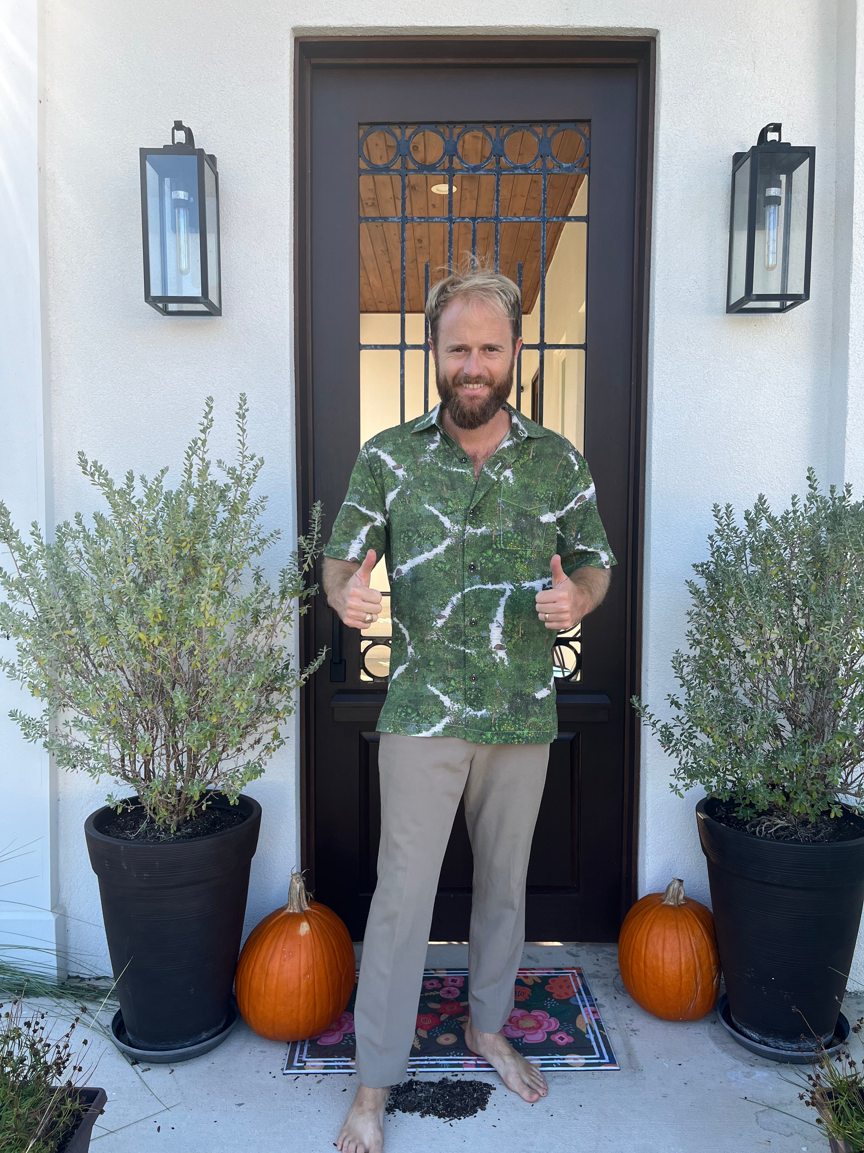 A man wearing the Florida Scrub Floridian Shirt by Okihasi. 